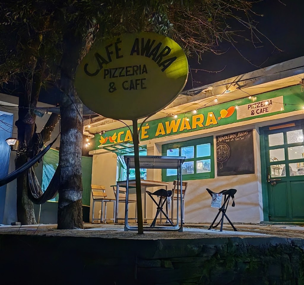 Cafe Awara outdoor patio and hammock at night