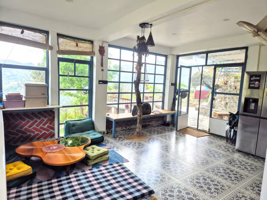 The Never Land B&B living room with fireplace and valley views