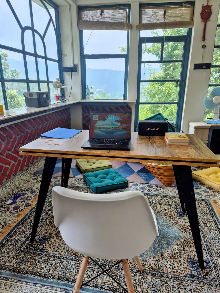 Sunlit workspace at The Never Land B&B with mountain views